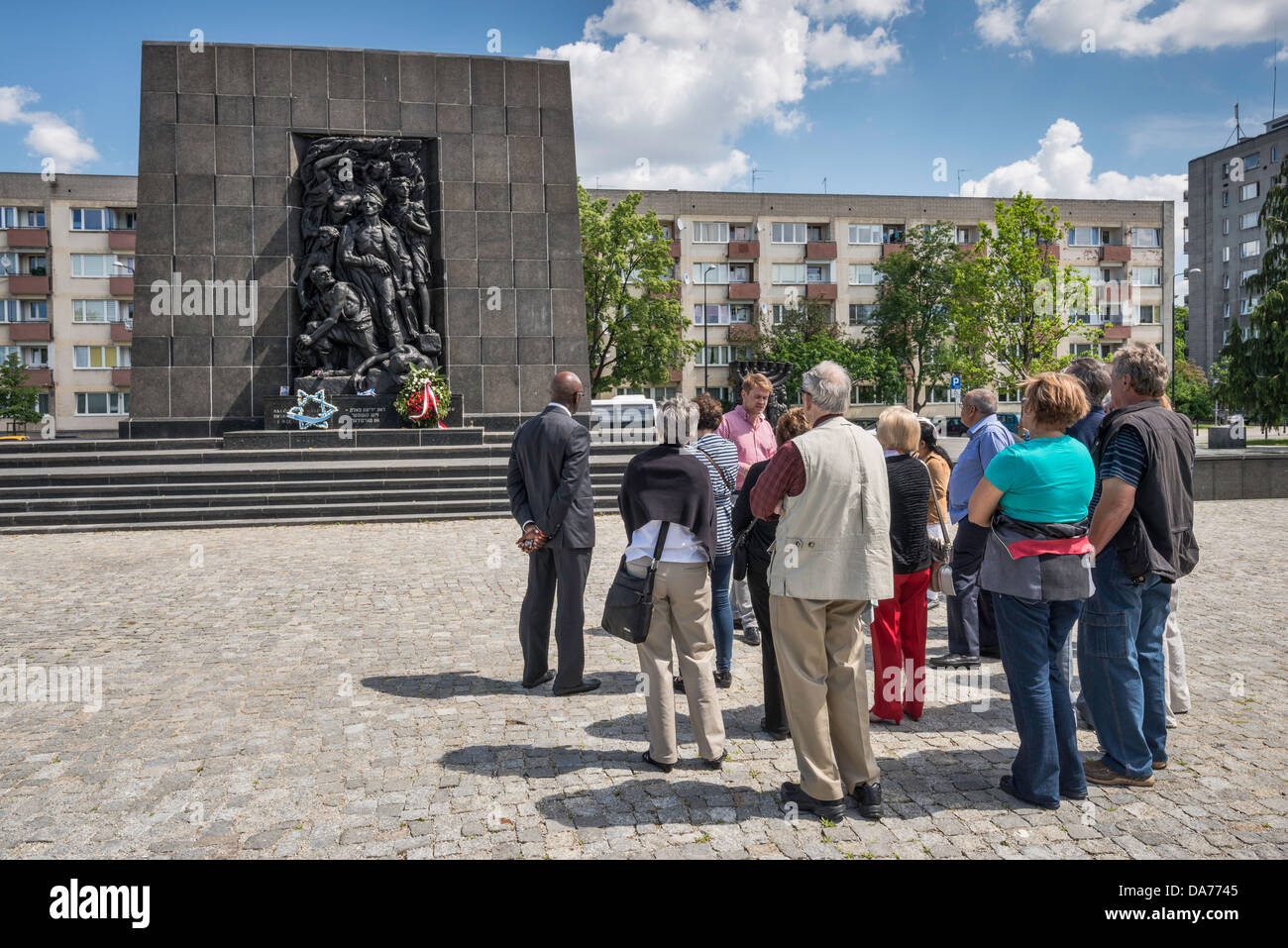 Visitors at Ghetto Heroes Monument, in front of Museum of the History of Polish Jews, Warsaw, Poland Stock Photo