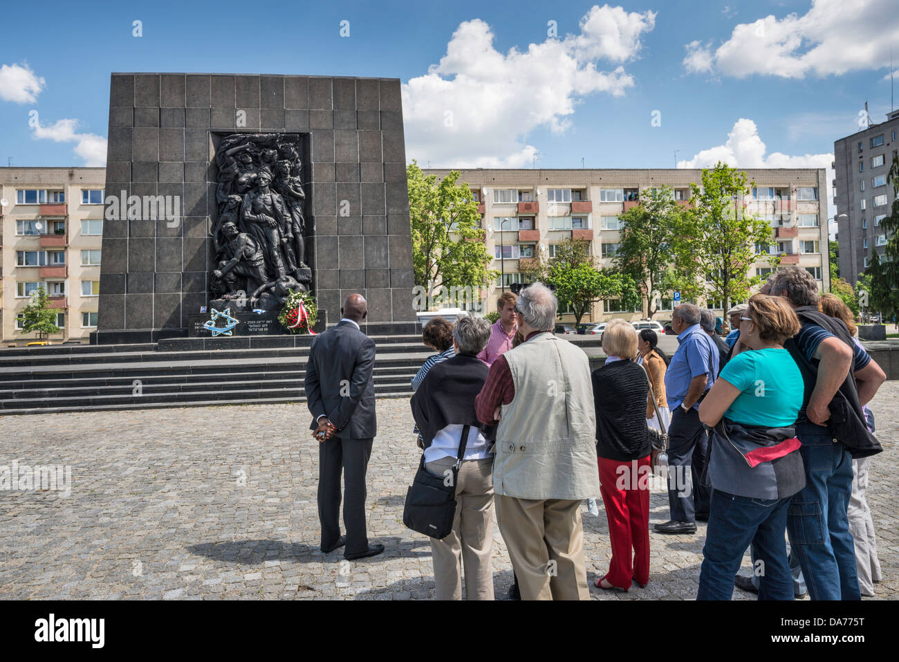 Visitors at Ghetto Heroes Monument, in front of Museum of the History of Polish Jews, Warsaw, Poland Stock Photo