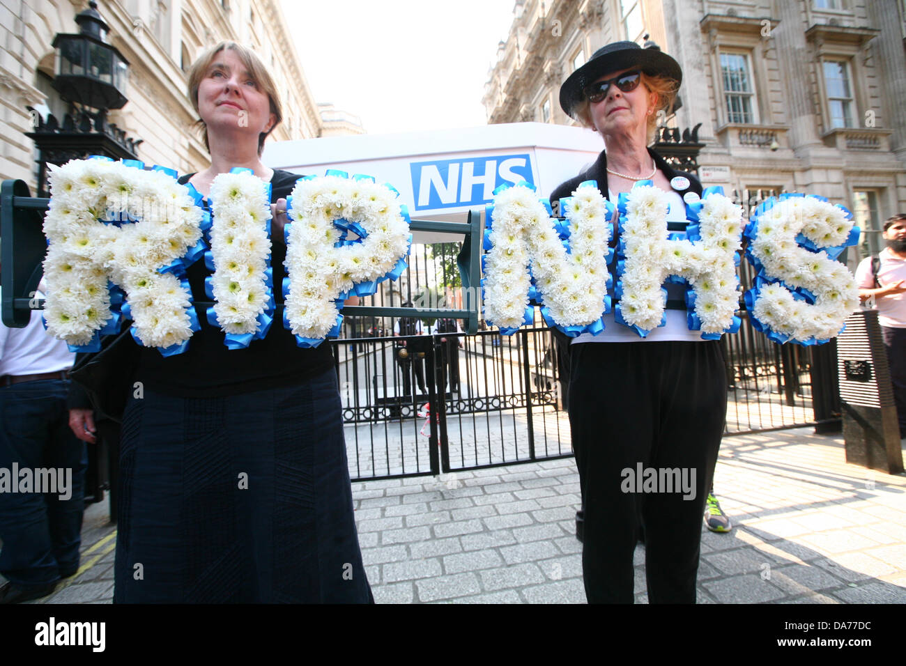 London, UK. 5th July, 2013. Medical staff march to Downing Street to protest privatisation NHS on the 65th anniversary of it's founding. Jacky Davis is holding the NHS wreath  Credit:  Mario Mitsis / Alamy Live News Stock Photo