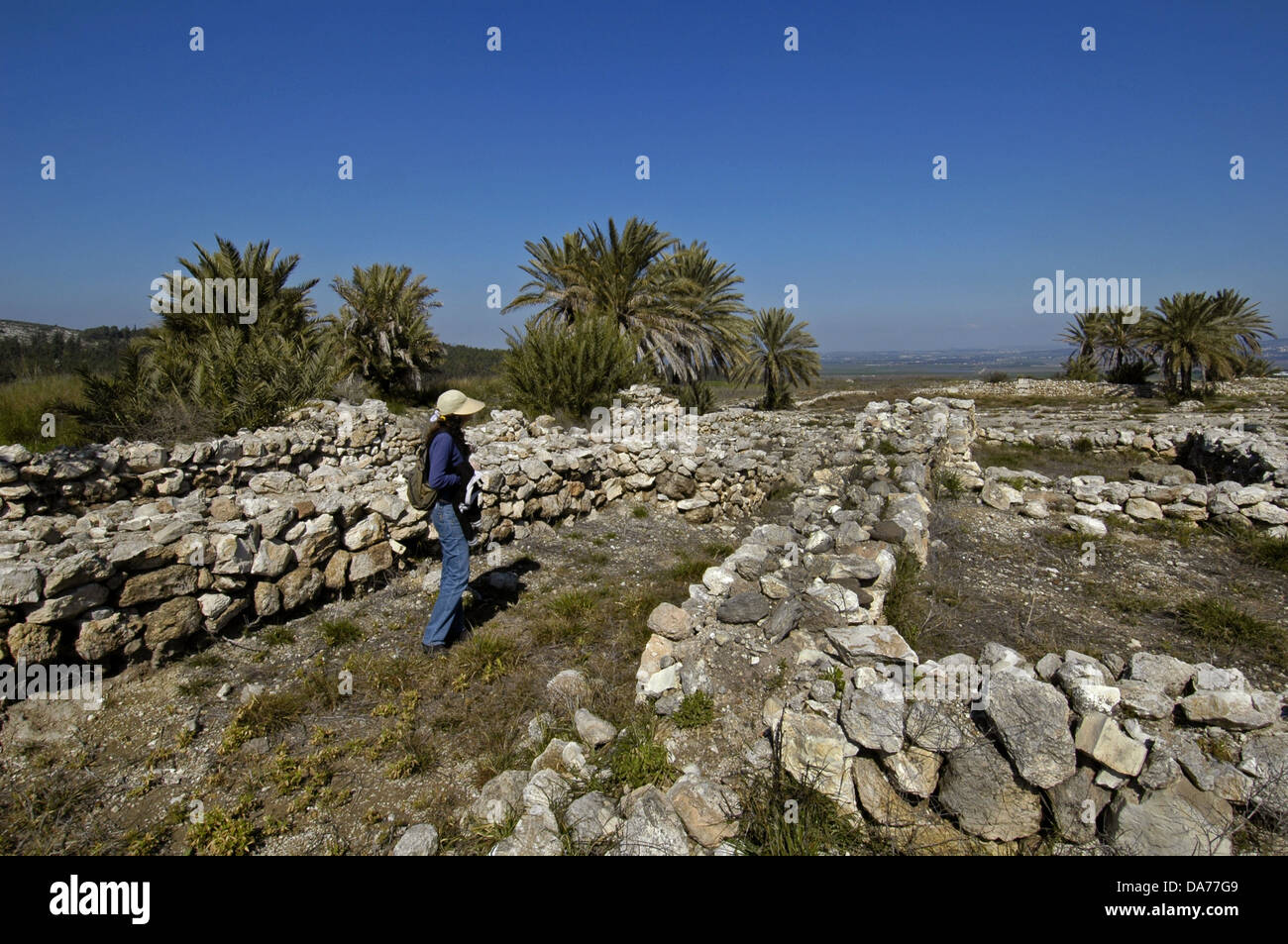 A hiker walking in Tell Megiddo archaelogical site and UNESCO World