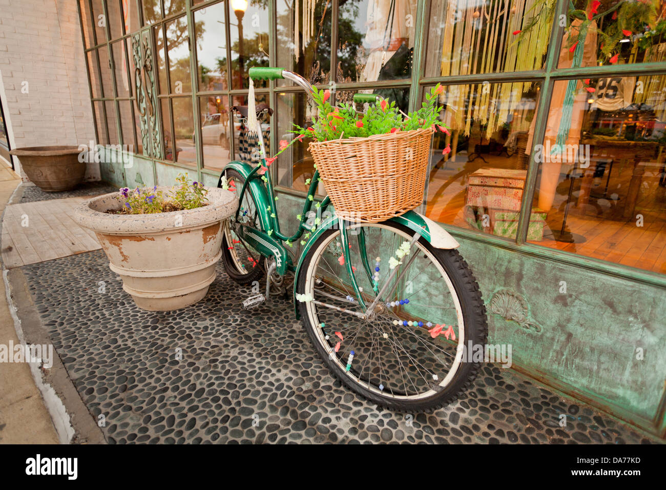 Parked bicycle outside of store window - USA Stock Photo