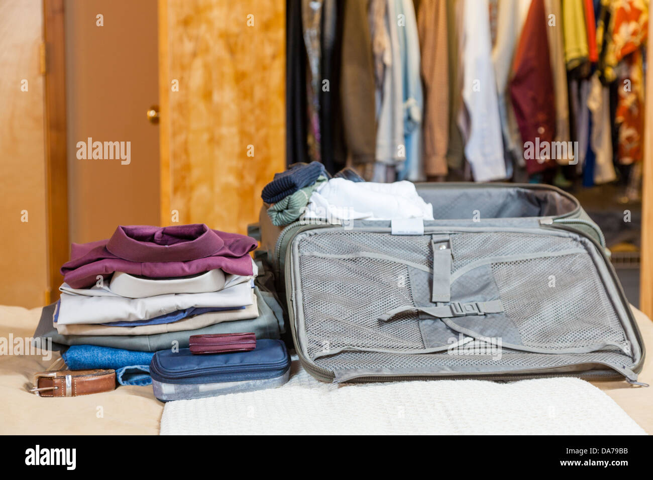 Open suitcase with clothes Stock Photo