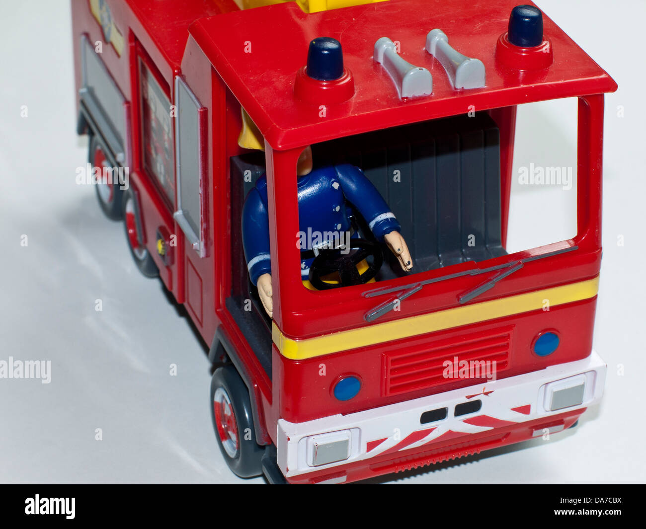 A toy fire engine with driver. Stock Photo