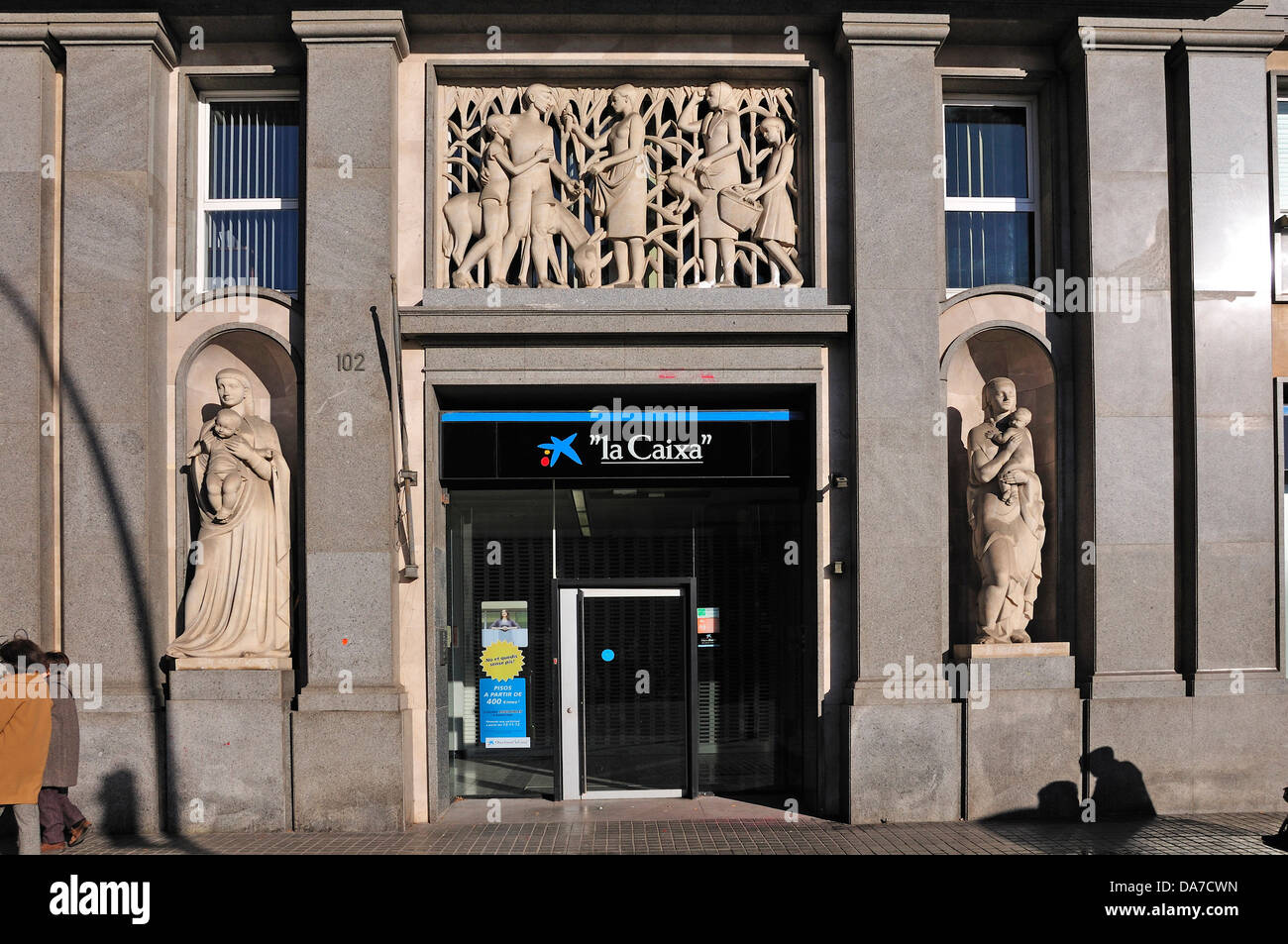 Barcelona, Catalonia, Spain. Facade of of 'La Caixa' bank at 102 Placa de Mossen Jacint Verdaguer Stock Photo