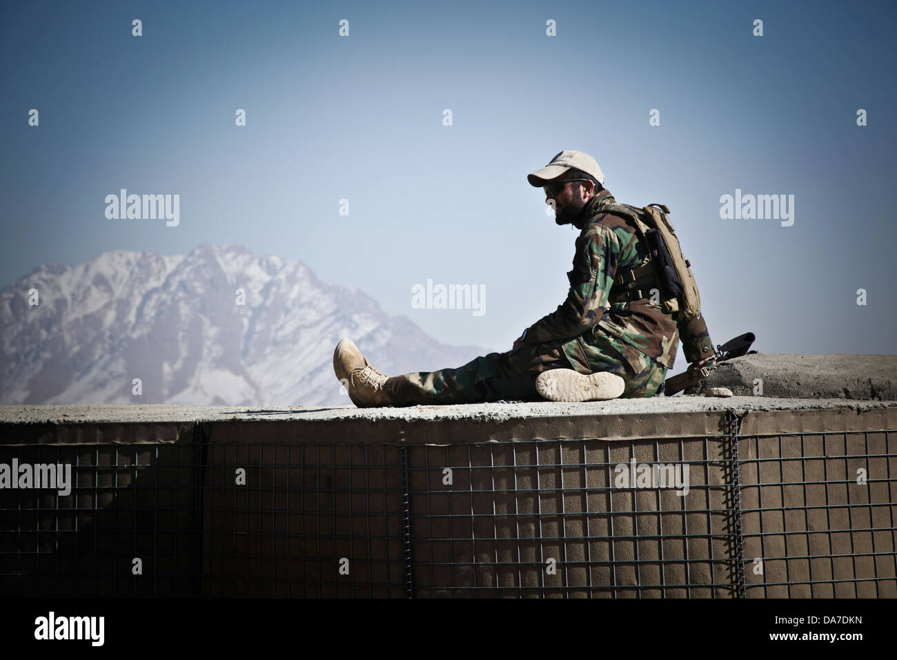 An Afghan special forces soldier takes a break during a training exercise February 17, 2013 at Forward Operating Base Scorpion in Kabul province, Afghanistan. Stock Photo