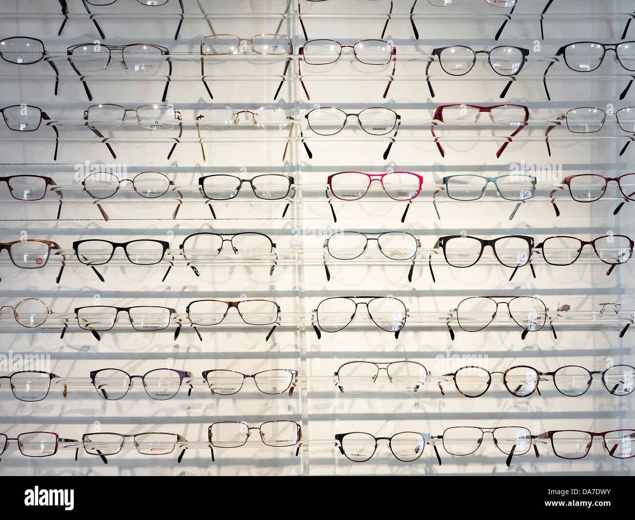Glasses display at wall mounted panel Stock Photo Alamy