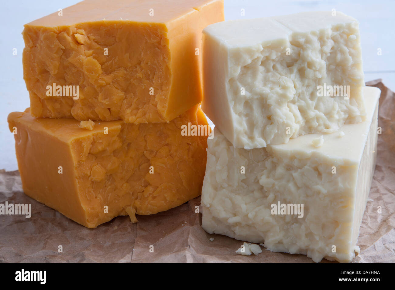 stacked chunks of cheddar and jack cheese Stock Photo Alamy