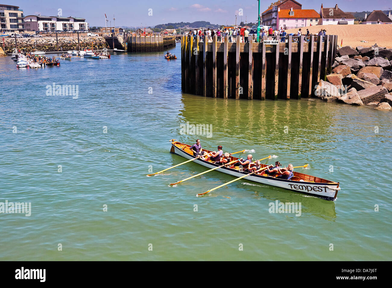 West Bay, Bridport, Dorset. 6th July, 2013.   Cornish Pilot Gigs take part in the Bridport Gig Regatta. Nine clubs from the South West raced over the 1.7 mile course along Dorset's Jurassic coast. Originally used for taking pilots to ships  Gig’s are now used for the rapidly expanding sport of Gig Racing. Credit:  Tom Corban/Alamy Live News Stock Photo