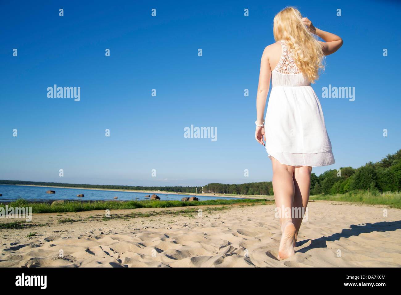 Woman in white dress walking hi-res stock photography and images - Alamy