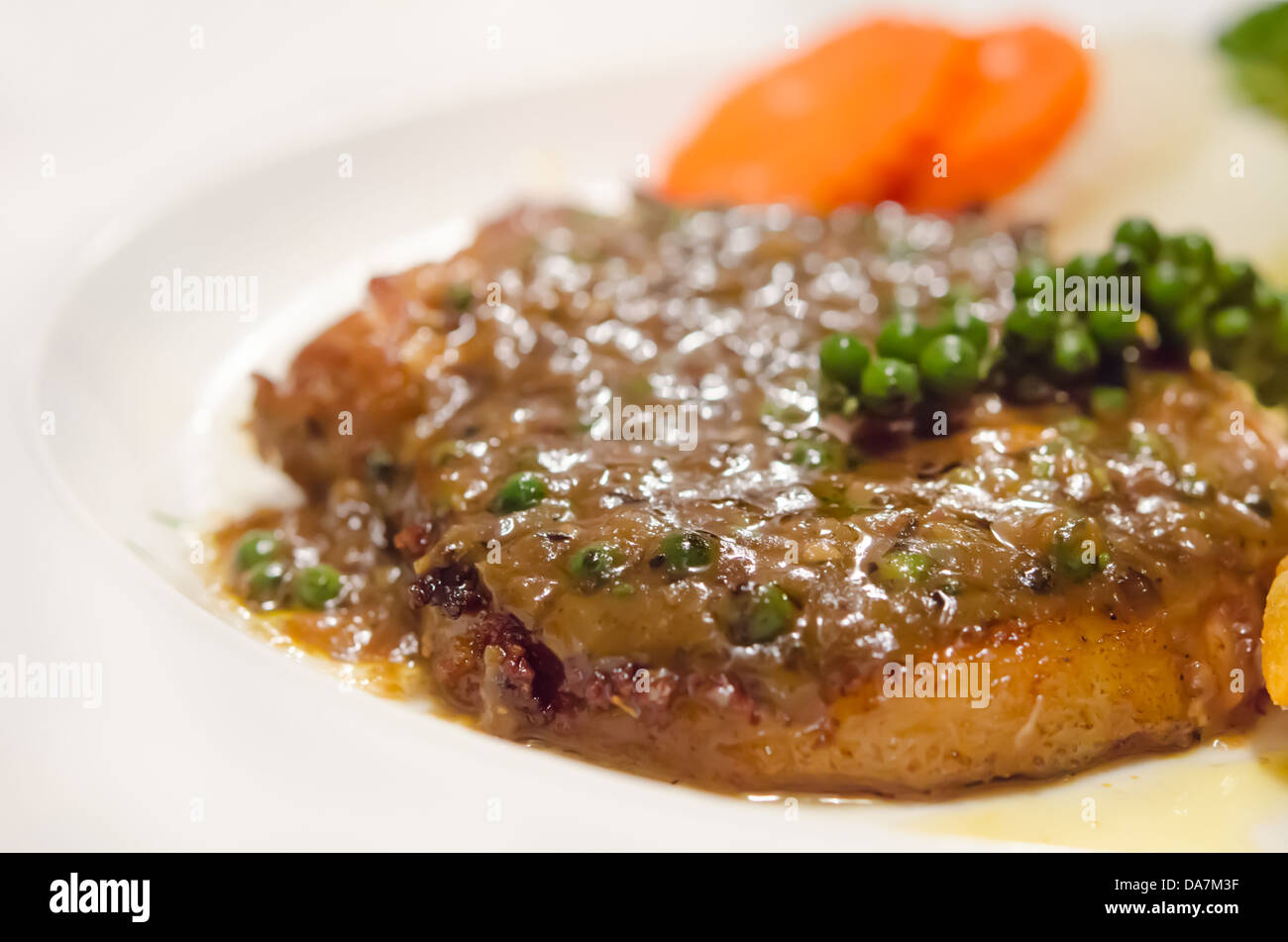 close up beef steak with green peppercorn sauce Stock Photo Alamy
