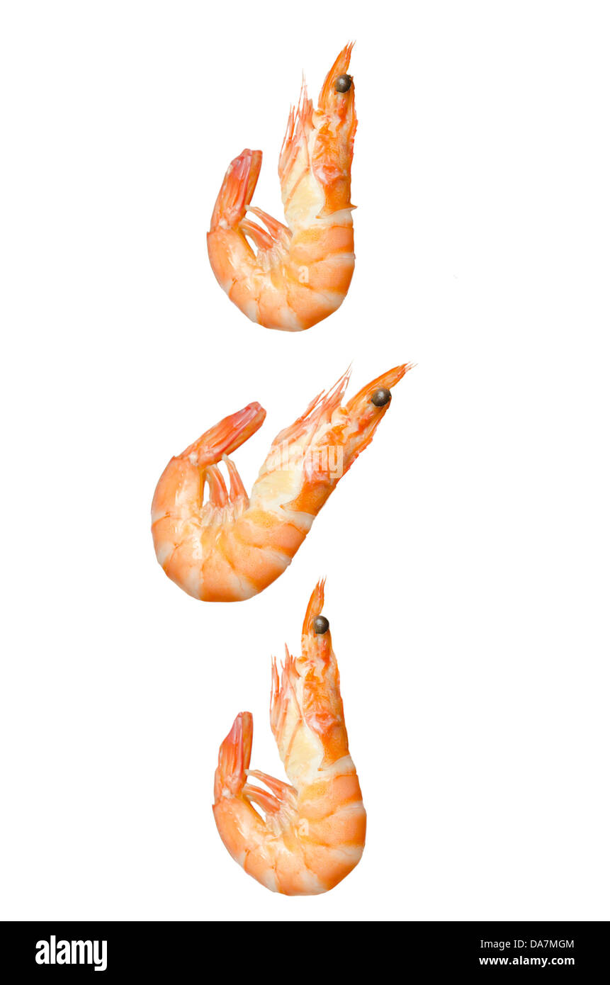 falling three boiled shrimps , seafood over white Stock Photo