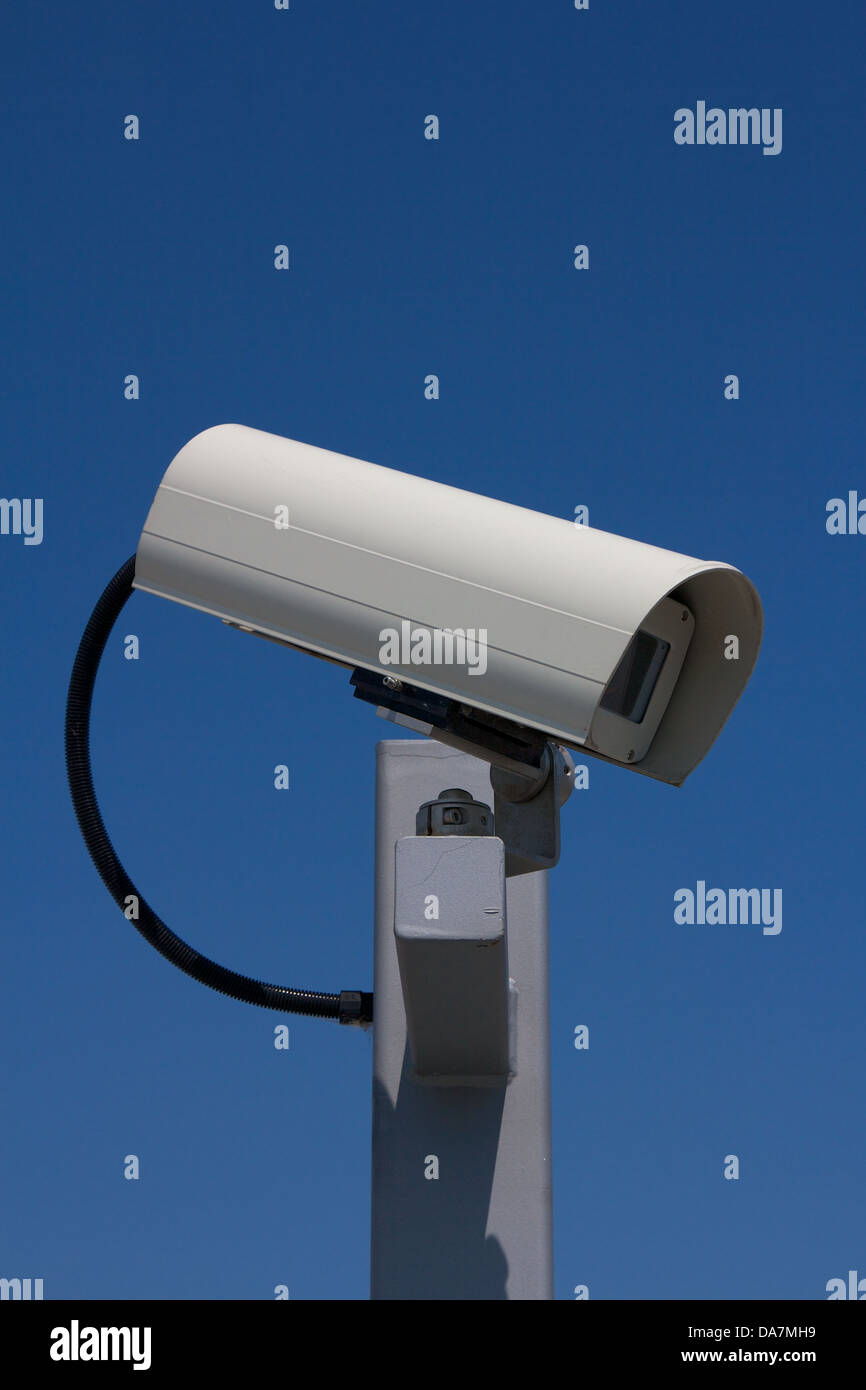 Closeup of modern outdoor surveillance camera facing right Stock Photo