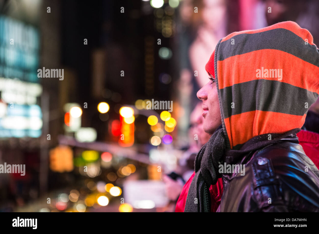 Profile Portrait of a Times Square tourist with the city lights in the background Stock Photo