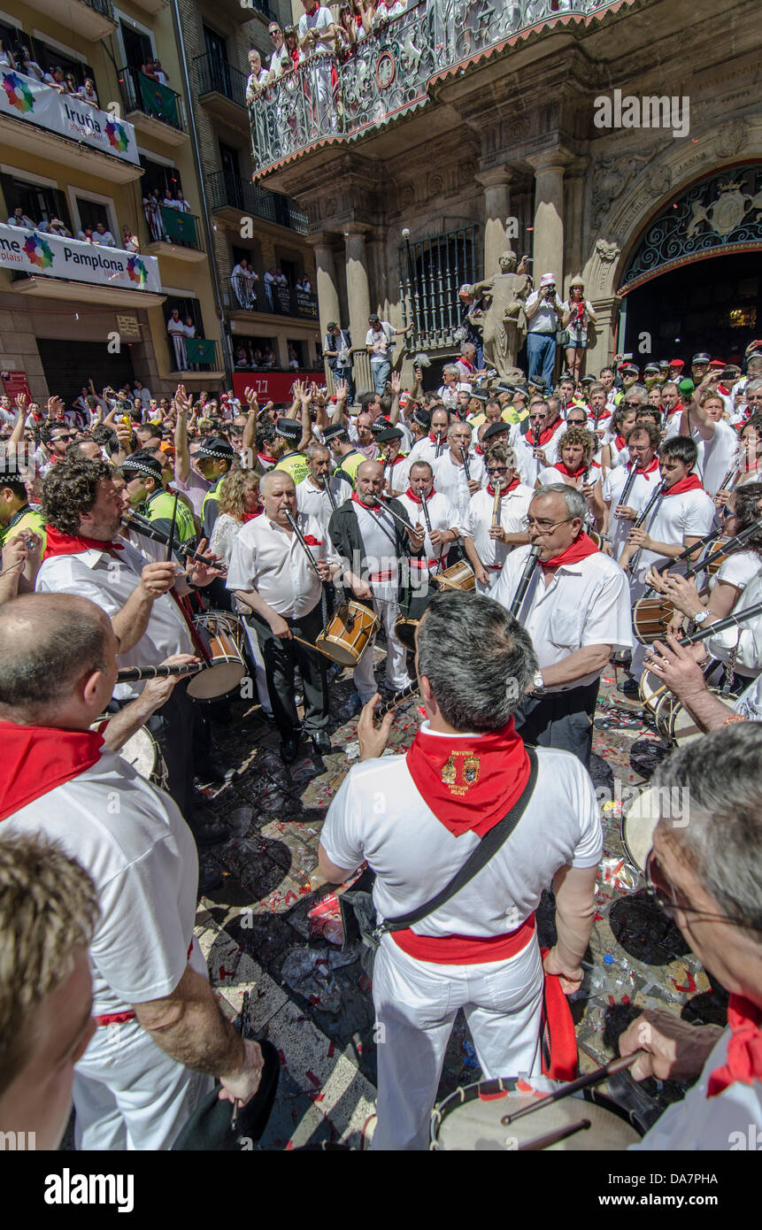 People celebrate dressed with traditional red and white in Pamplona ...