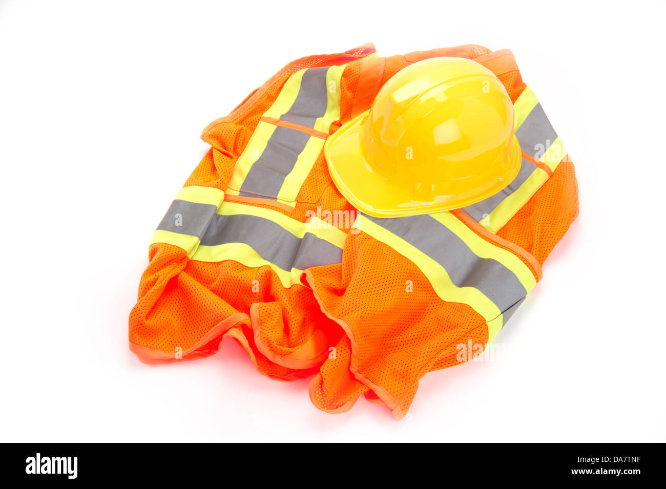 Safety vest and hard hat on white background Stock Photo - Alamy