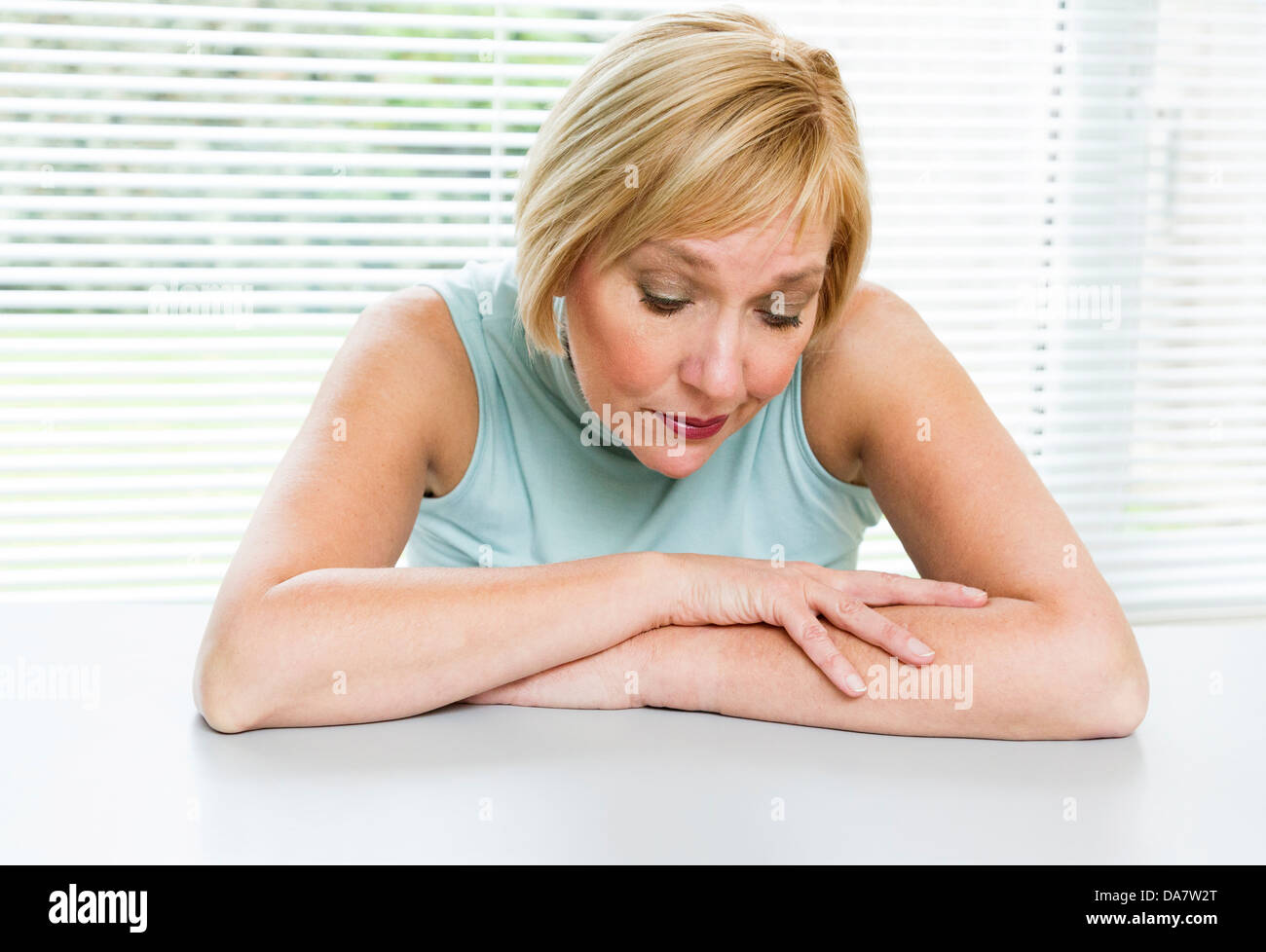 woman looking worried and concerned Stock Photo