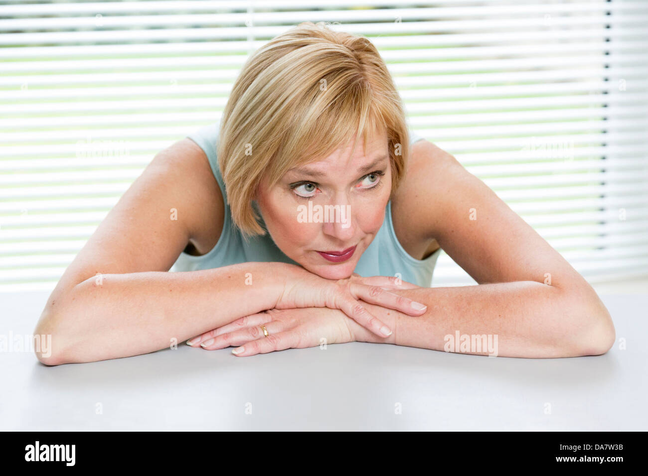 woman looking worried and concerned Stock Photo