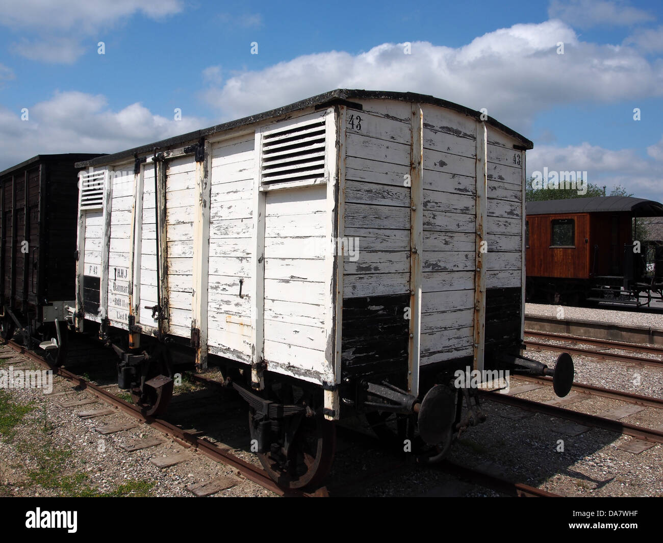This historical image showcases a Danish railroad car from the Mariager-Handest Veteranjernbane, a preserved heritage railway in Denmark. The railcar represents the region’s dedication to preserving historical transport systems for future generations. Stock Photo