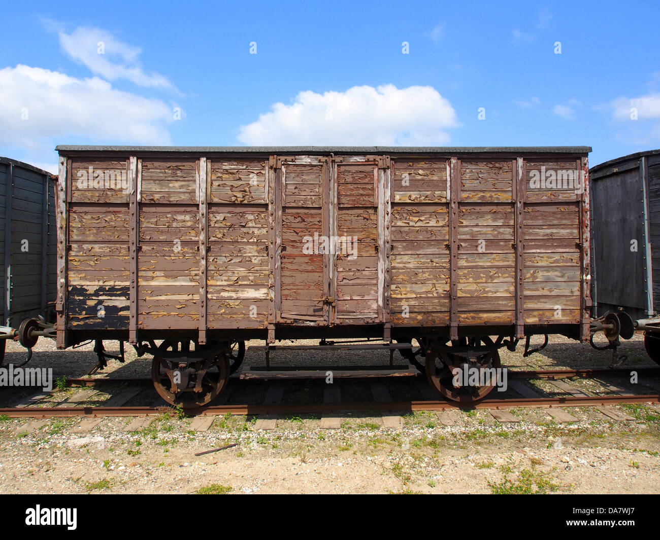 This image showcases a Danish railroad car from the Mariager-Handest Veteranjernbane, a heritage railway in Denmark. The vintage railcar, also known as a railway carriage or wagon, is part of the preserved fleet that offers historical train rides along scenic routes in Denmark. Stock Photo