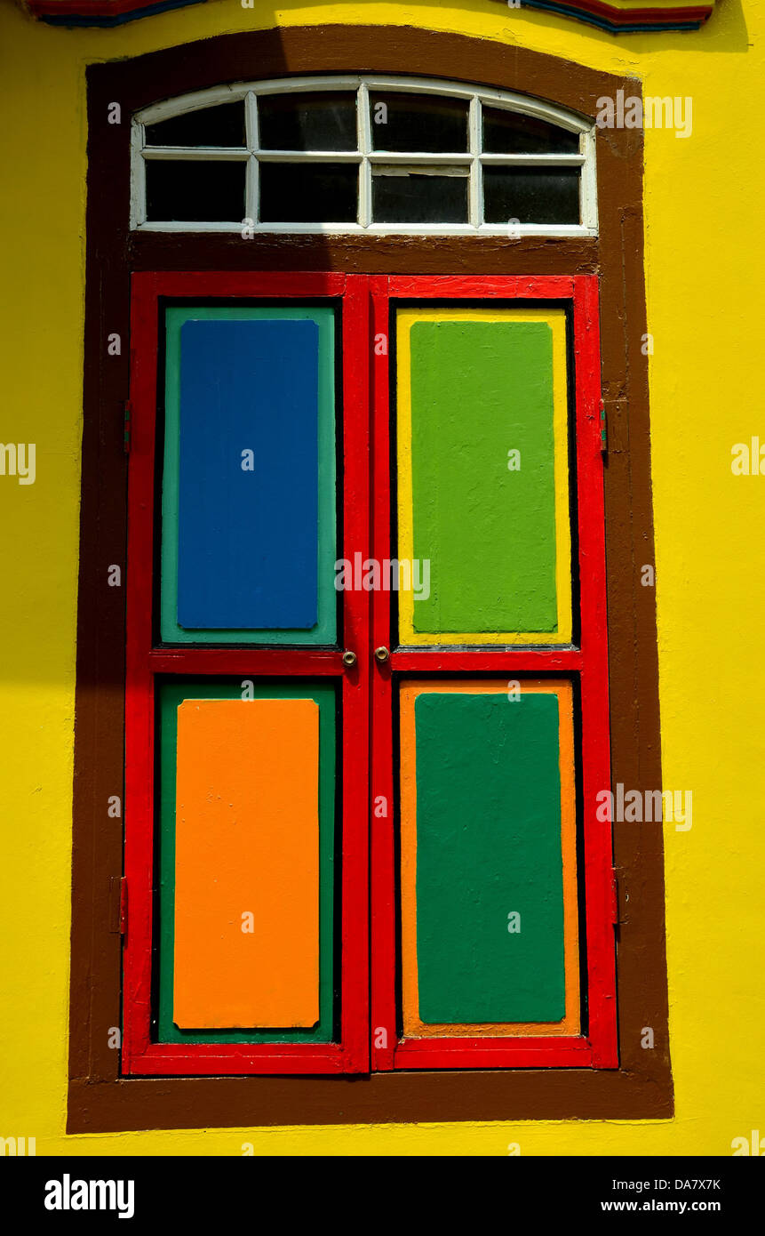 Colorful window shutters and glass pane windows Stock Photo Alamy