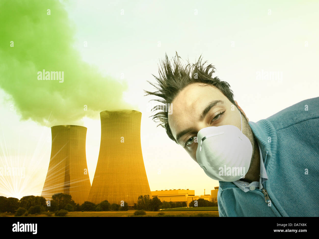 Young boy with mask respiratory protection near nuclear reactors Stock Photo