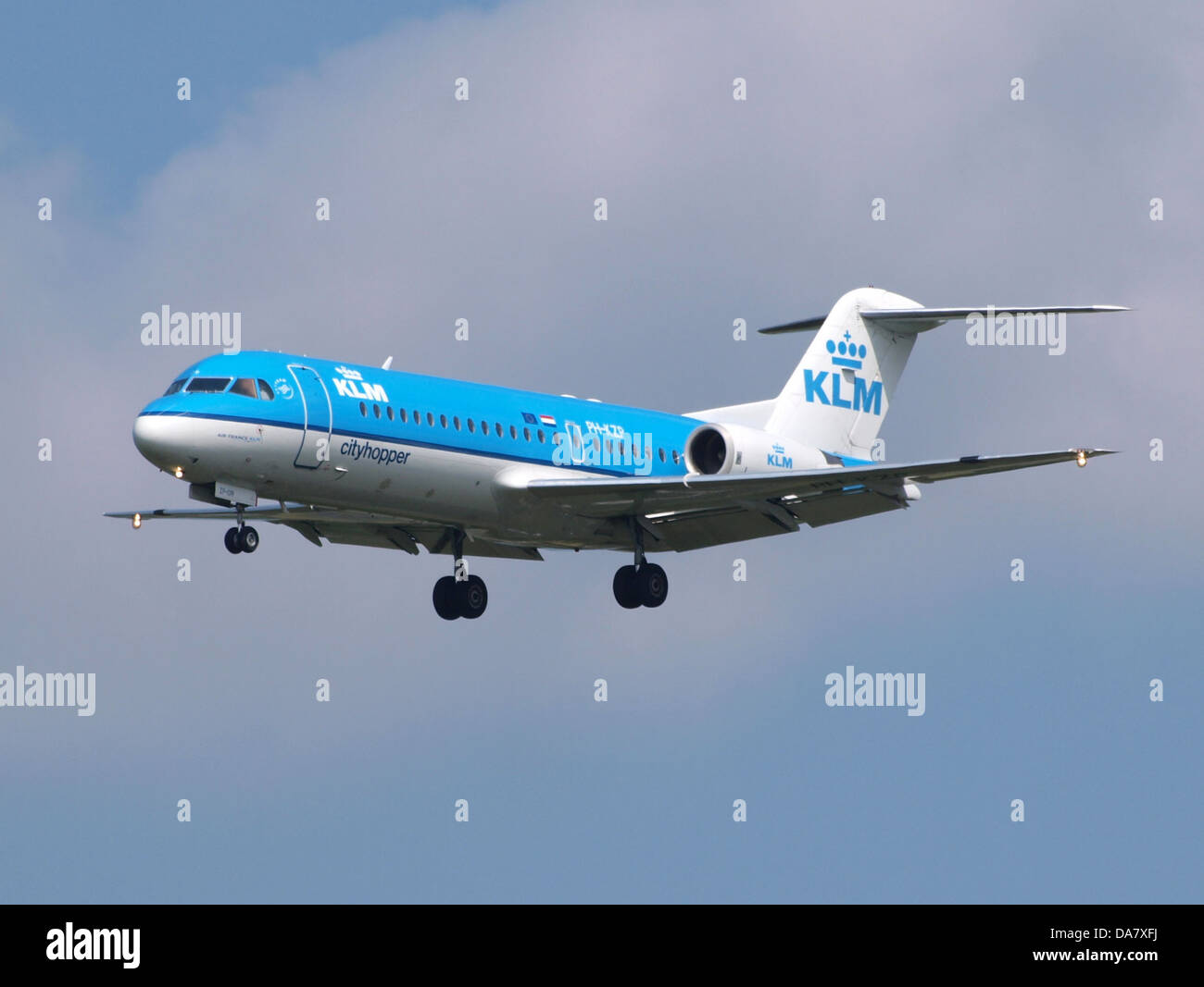PH KZP is a Fokker 70 aircraft operated by KLM Cityhopper, seen landing or taking off at Amsterdam Schiphol Airport in the Netherlands. The aircraft is part of the regional fleet for KLM. Stock Photo