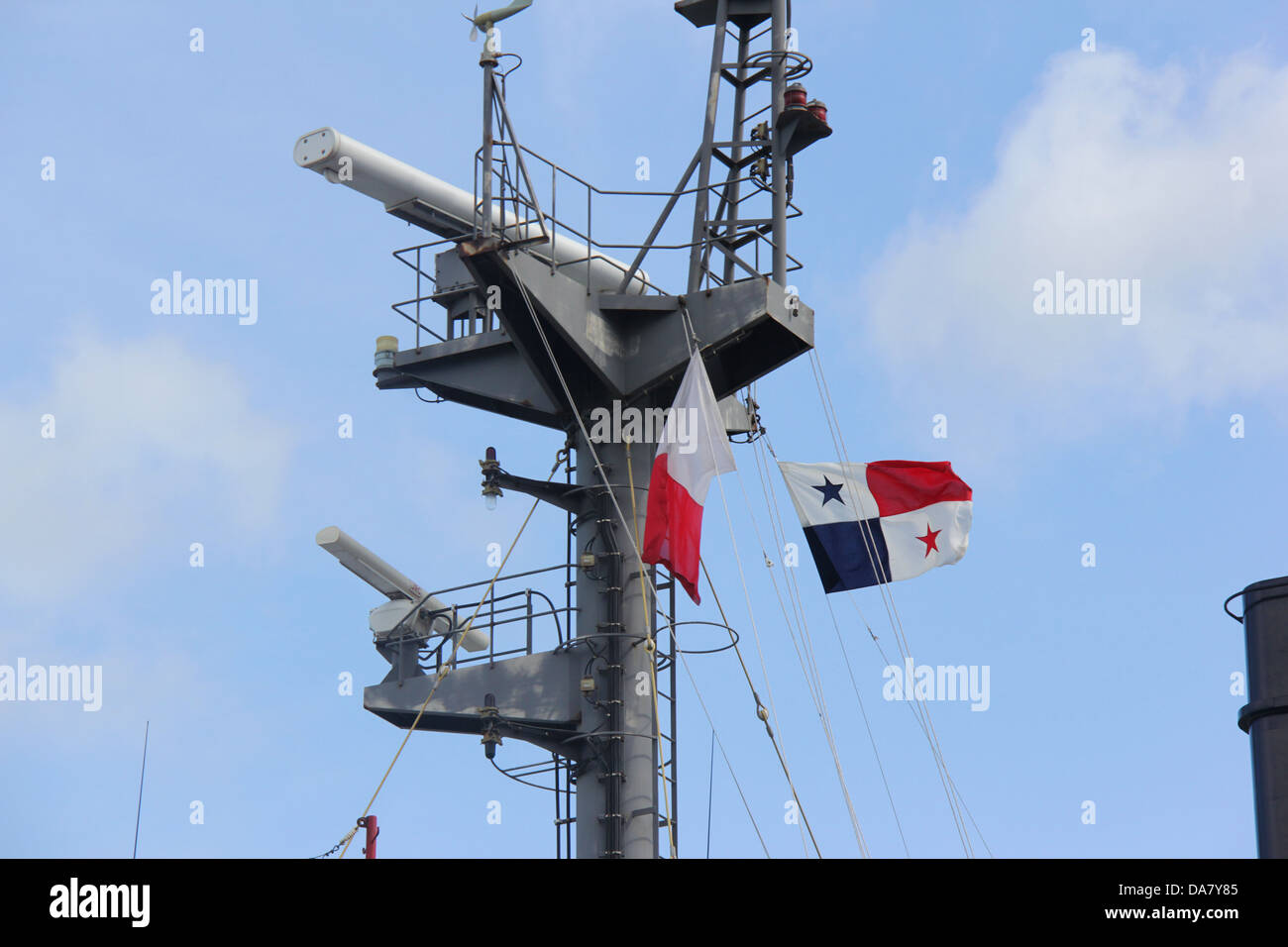 Panamanian flag waving on a ship's main mast during a transit through