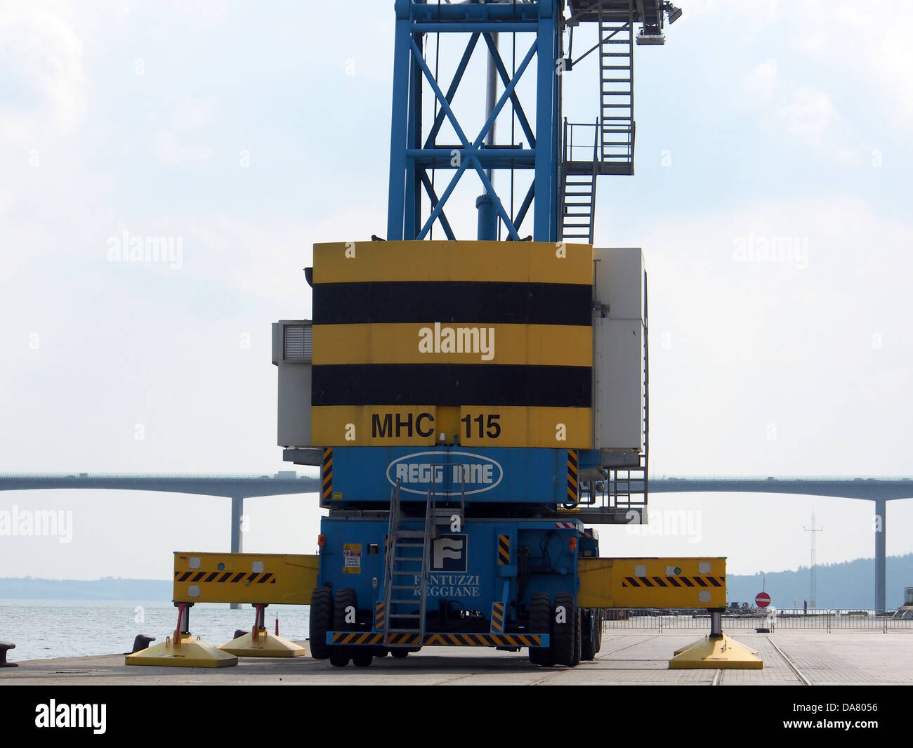 The Terex Fantuzzi Reggiane MHC 115 is a heavy-duty harbor crane used at Fejle harbor for efficient cargo handling. This crane features advanced lifting capabilities to support industrial and logistical operations. Stock Photo