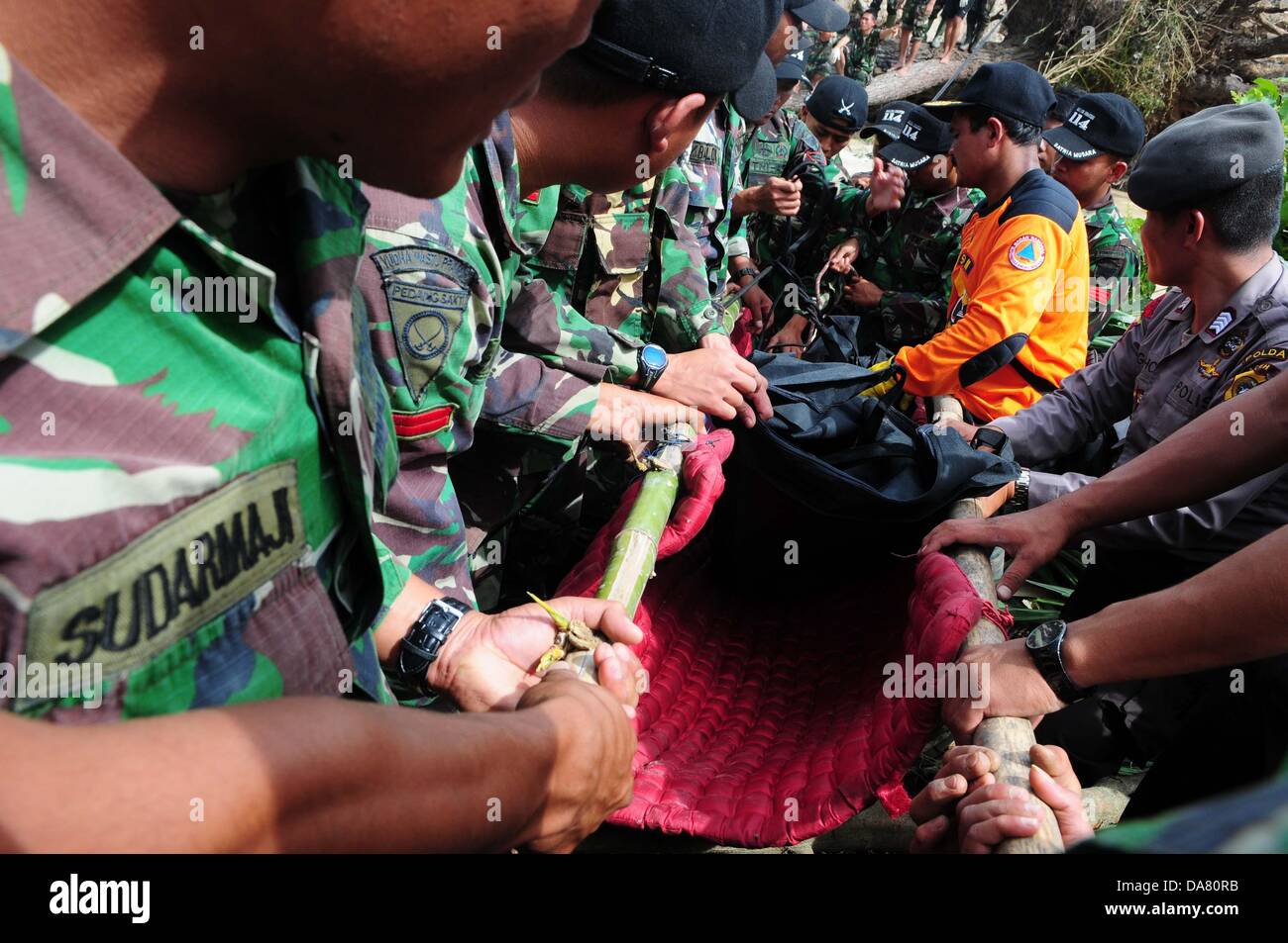 Aceh Indonesia 5th July 2013 Indonesia Military Carry A Victim Body By An Earthquake In 