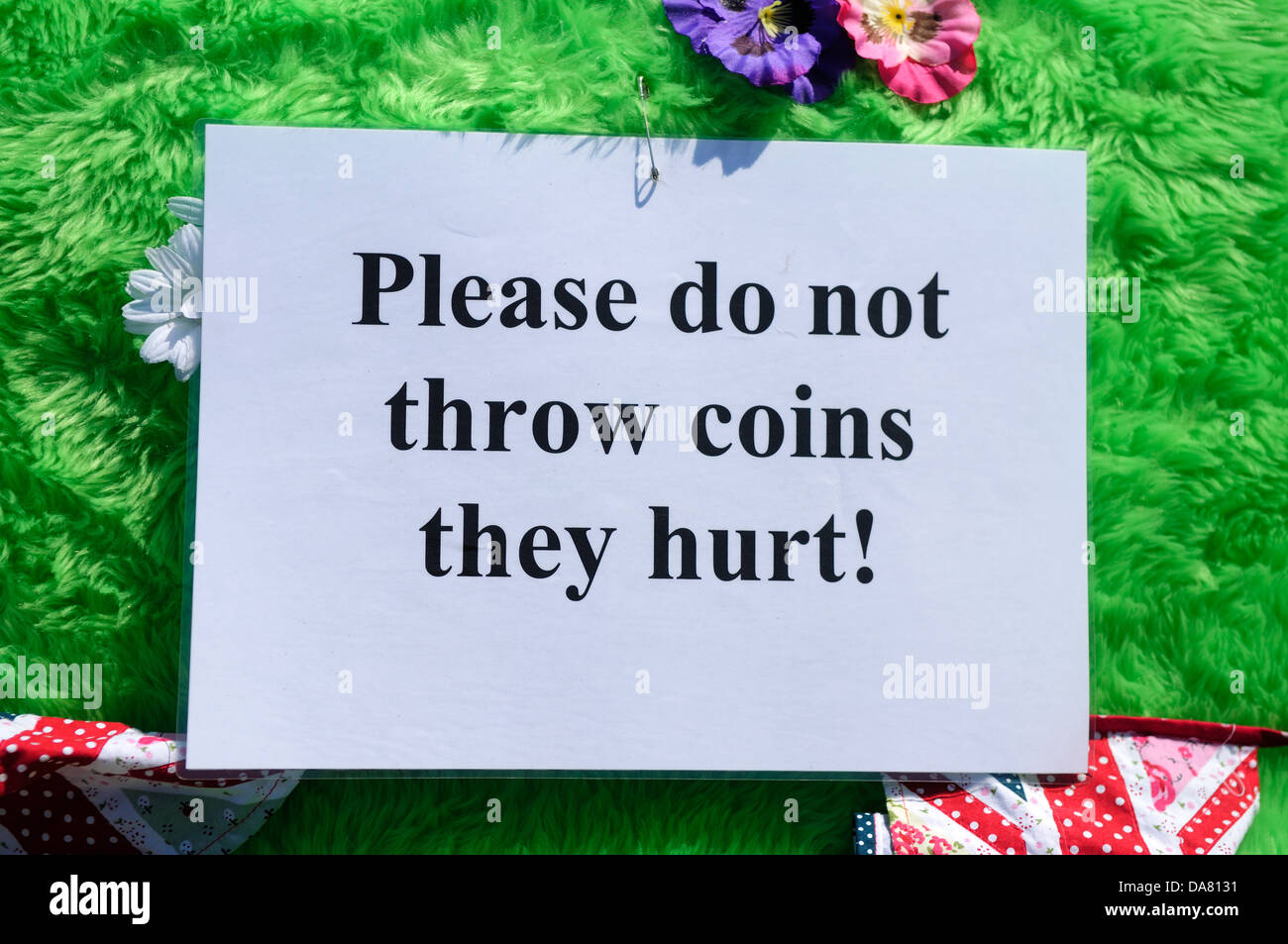 Sign Warning 'Please Do Not Throw Coins They Hurt' At Open air Charity
