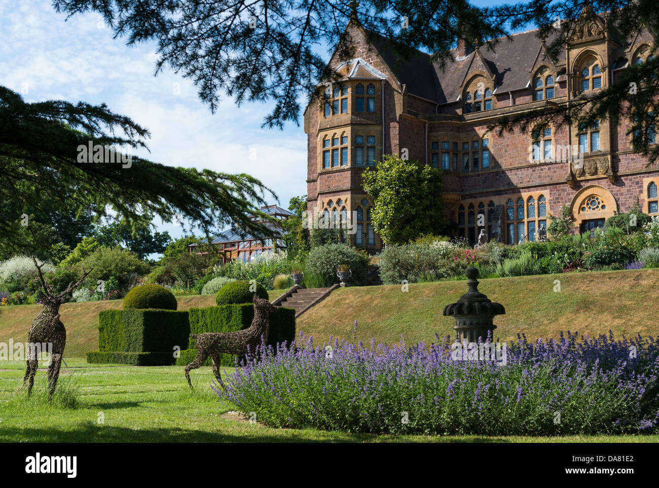 Bolham, Tiverton, Devon, UK. July 5th 2013. The front of Knightshayes Court and part of the formal gardens. Stock Photo