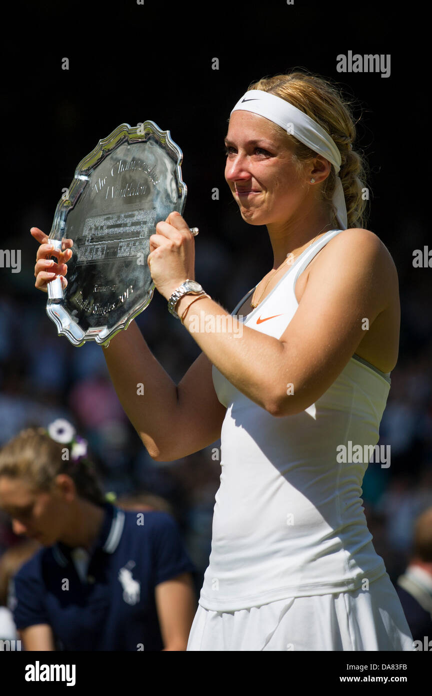 London, UK. 06th July, 2013. Tennis: Wimbledon Championship 2013, Sabine Lisicki of Germany poses with her runner-up trophy after her Ladies' Singles final match against Marion Bartoli of France on day twelve of the Wimbledon Lawn Tennis Championships at the All England Lawn Tennis and Croquet Club on July 6, 2013 in London, England. Credit:  dpa picture alliance/Alamy Live News Stock Photo