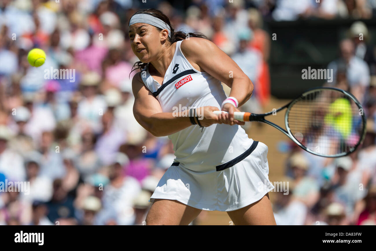 London, UK. 06th July, 2013. Tennis: Wimbledon Championship 2013, Marion Bartoli of France in action during the Ladies' Singles final match against Sabine Lisicki of Germany on day twelve of the Wimbledon Lawn Tennis Championships at the All England Lawn Tennis and Croquet Club on July 6, 2013 in London, England. Credit:  dpa picture alliance/Alamy Live News Stock Photo