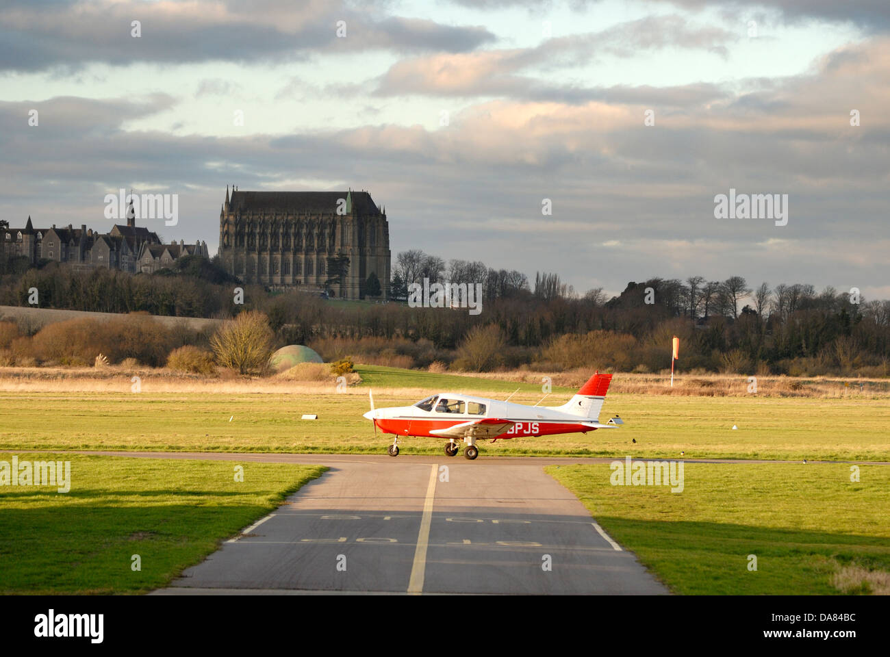 A Piper PA-28-161 taxi's towards take off at Shoreham (Brighton City) Airport in West Sussex. Stock Photo
