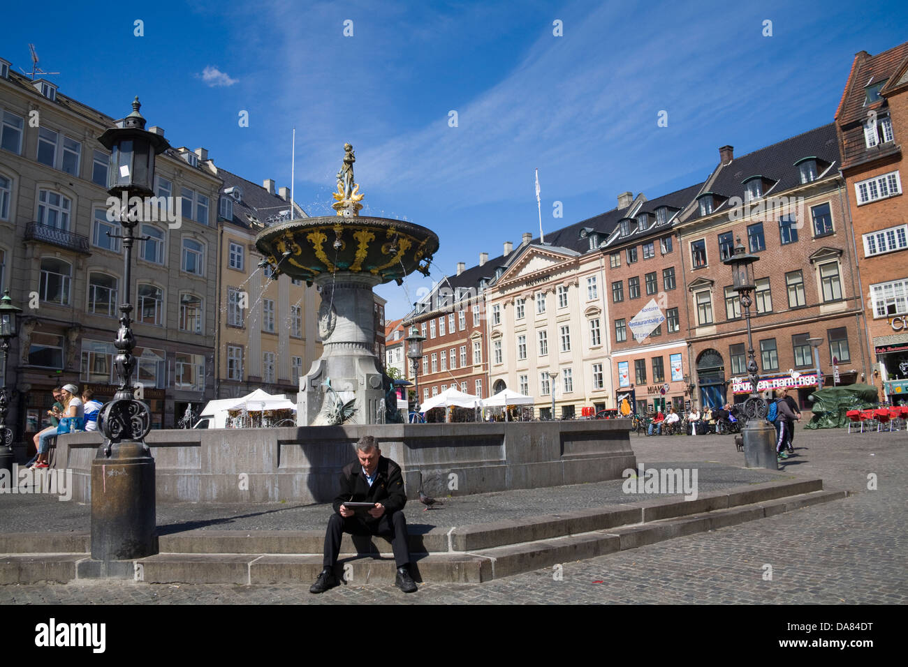 Copenhagen Denmark EU Gammeltorv dominating feature Caritas Well a Renaissance fountain erected by King Christian IV in 1610 Stock Photo