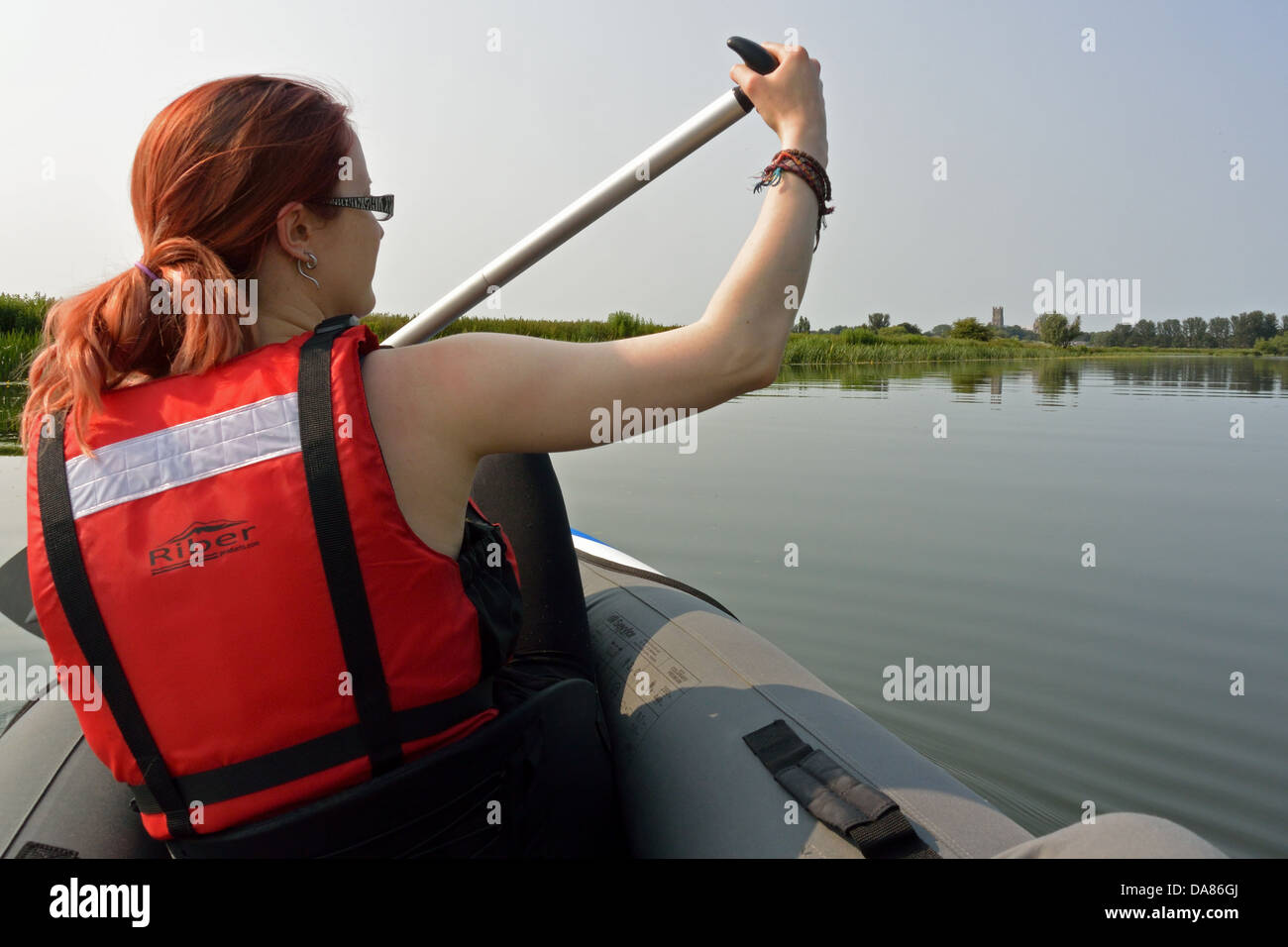 Young woman paddling a Sevylor Colorado Premium inflatable canoe on the  River Great Ouse towards Ely, Cambridgeshire Stock Photo - Alamy