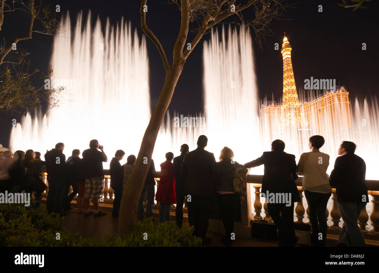 Visitors look at the fountain display of the Bellagio on the Strip in Las Vegas, NV, USA, March 9, 2011. (Adrien Veczan) Stock Photo