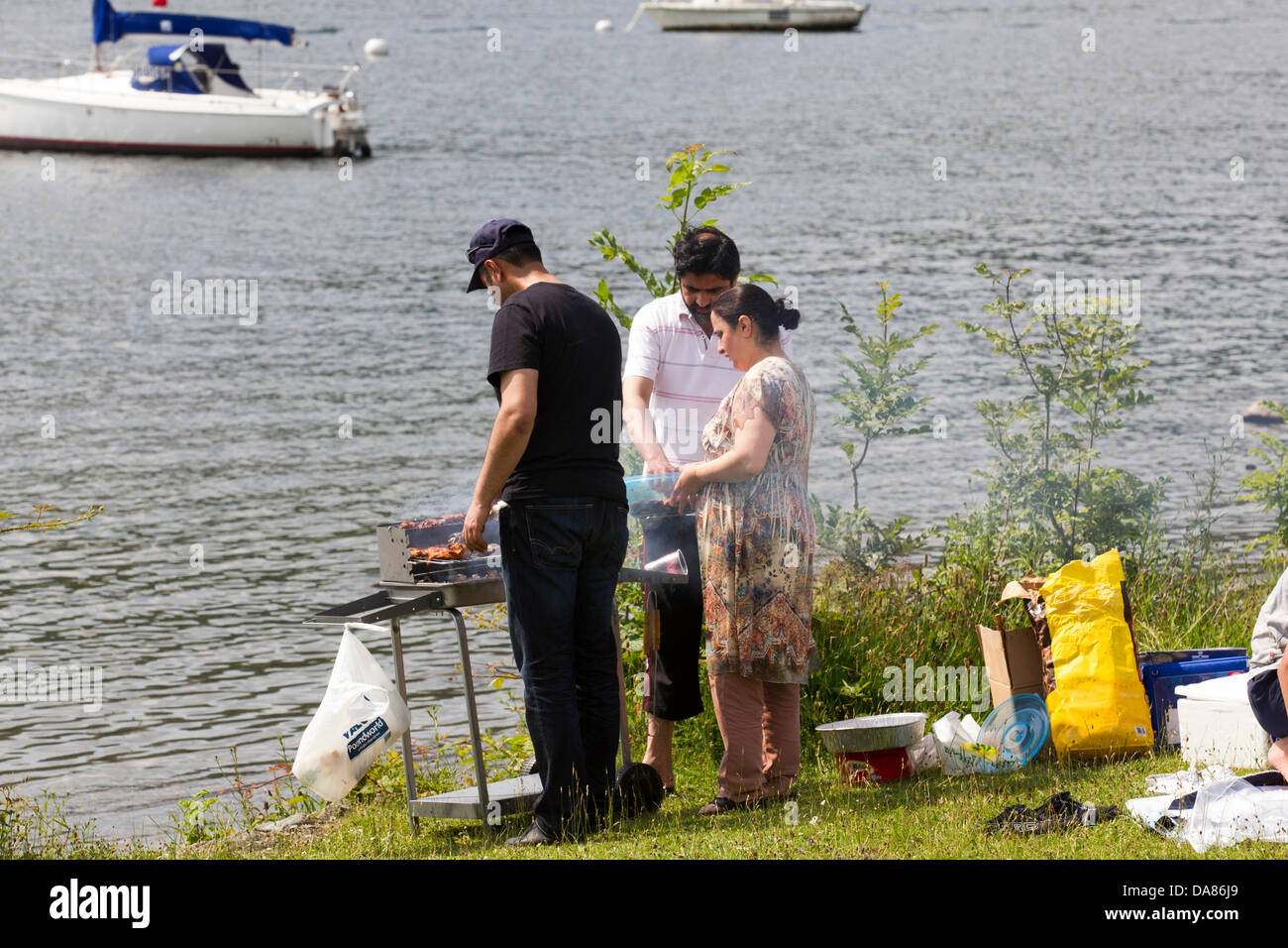 Bowness on Lake Windermere, Cumbria, UK. July 07th, 2013. People making