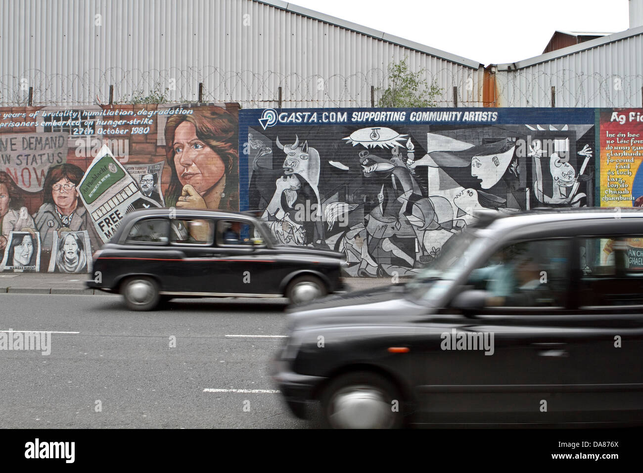 Black Cabs in front of Peace Mural in East Belfast, Northern Ireland Stock Photo