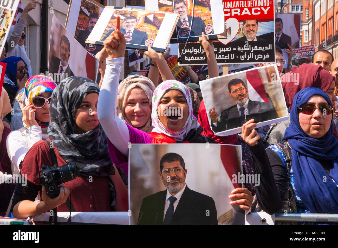London, UK. 7th July, 2013. Women chant for their country's democracy  as pro-Morsi Egyptians demonstrate outside the country's embassy in London, against the 'coup' that ousted President Morsi. Credit:  Paul Davey/Alamy Live News Stock Photo