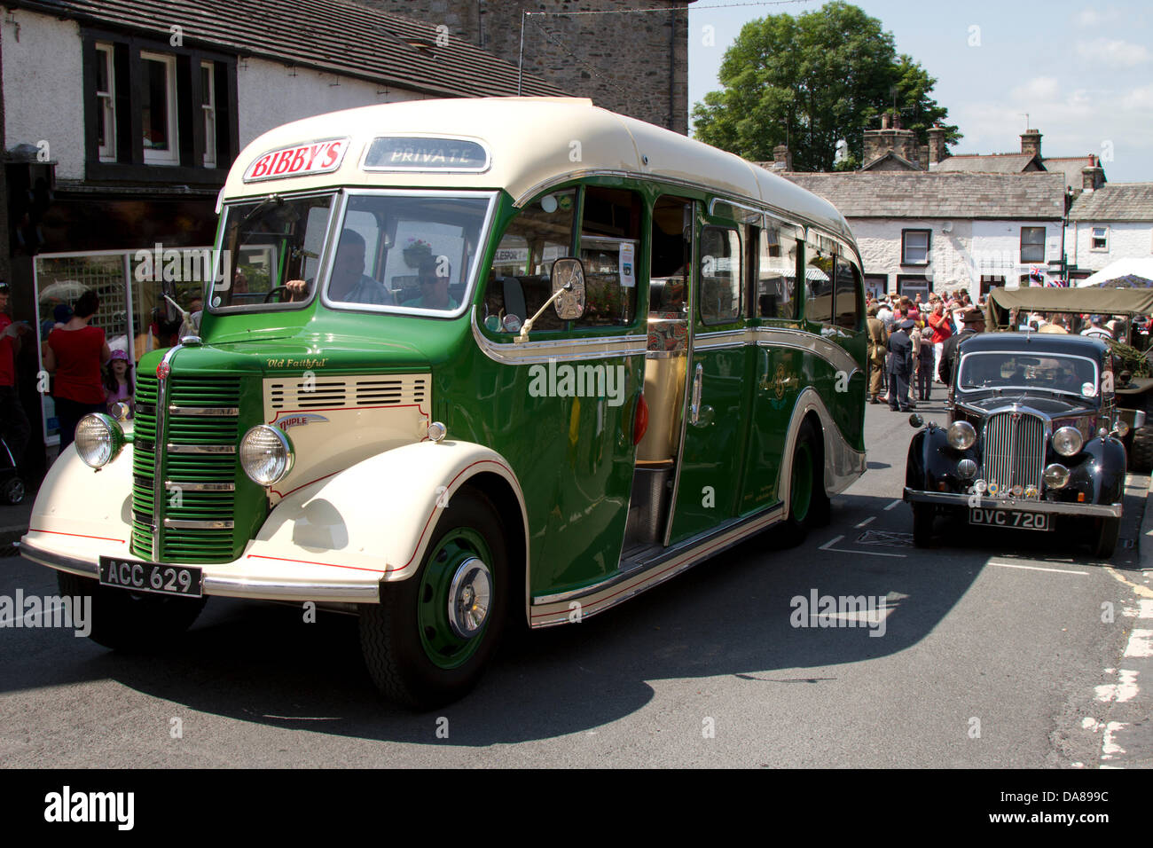 1950 50s green cream Bibby's vintage Bedford coach at Ingleton, UK. July, 2013. Vintage vehicles at  Operation Home Guard, Ingleton’s 1940’s weekend when Ingleton became the German-occupied French market town of La Chapell-De-Marais liberated by re-enactors & vintage, classic vehicles. Stock Photo