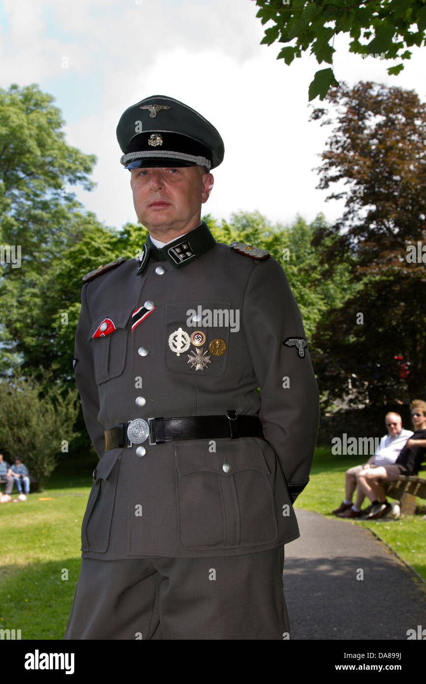 1940, 1941, 1942, 1943, 1944, German soldier at Ingleton, UK. 7th July, 2013. Reenactor dressed as German Hauptsturmführer a Nazi party officer of paramilitary rank. Historical reenactment with German soldiers at Operation Home Guard, Ingleton’s 1940’s weekend when Ingleton became the German occupied French market town of La Chapell-De-Marais liberated by re-enactors. Stock Photo
