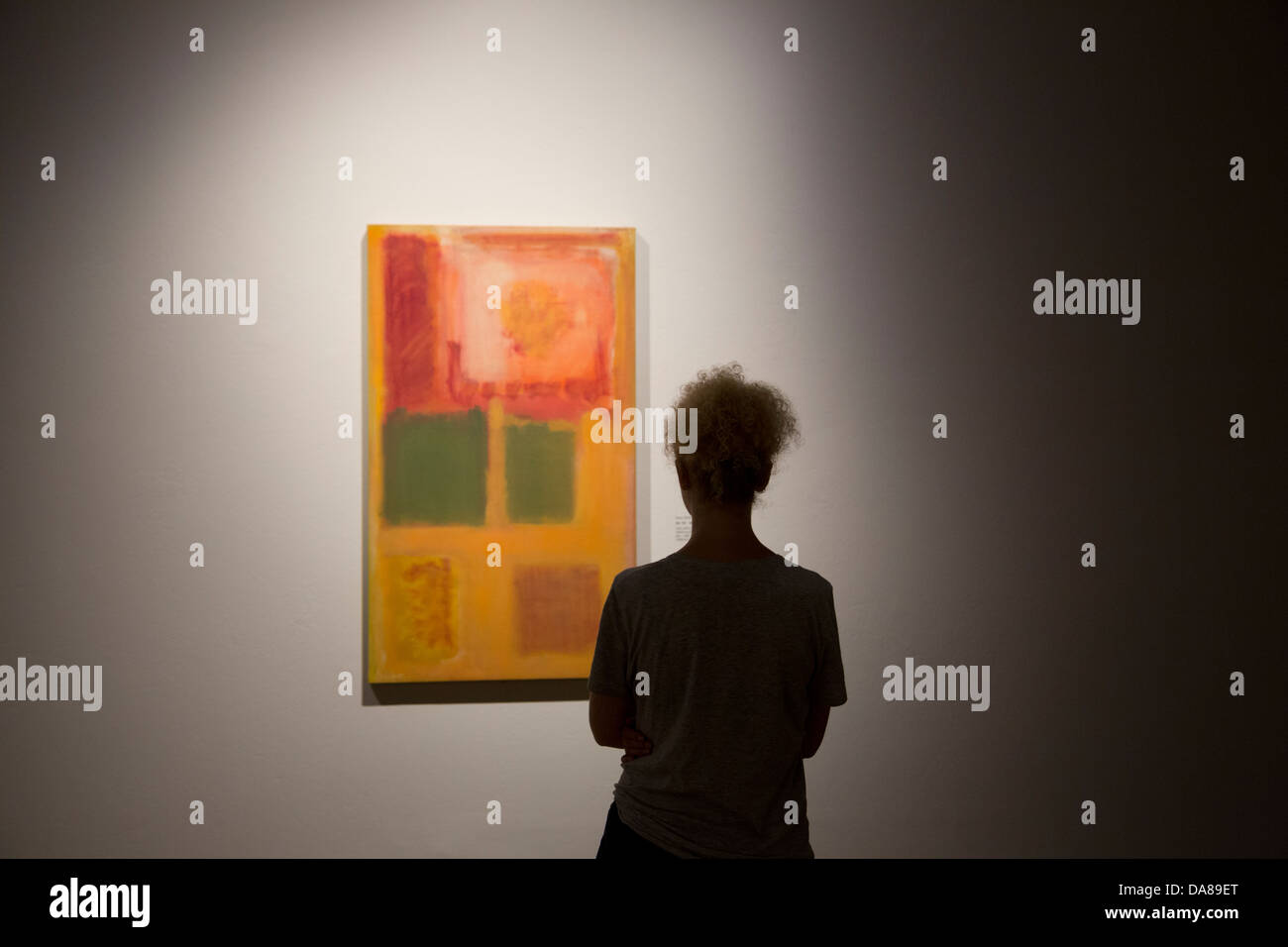 National Museum visitor studies a painting by Mark Rothko, a member of the Abstract Impressionists, Warsaw exhibition. Stock Photo
