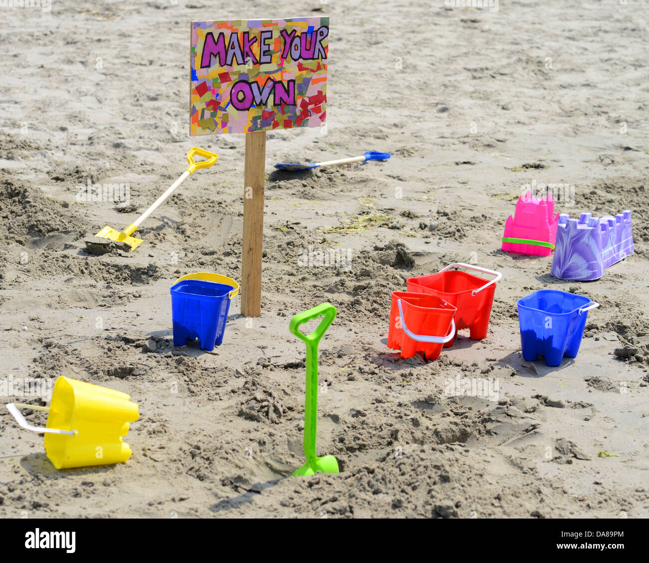 Buckets and spades on the beach Stock Photo Alamy