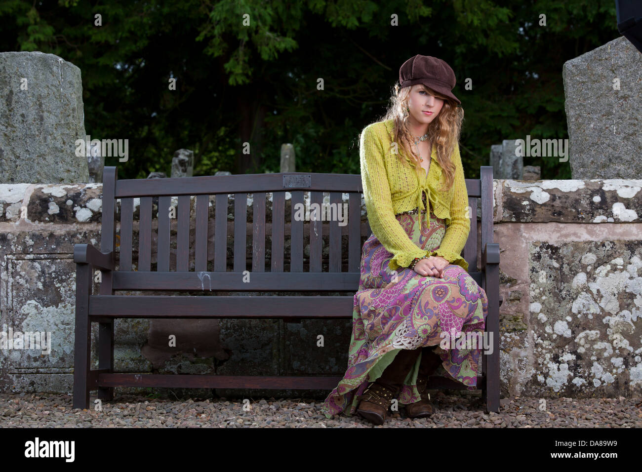 An Attractive Woman With Long Dark Blonde Hair Sitting On A Church