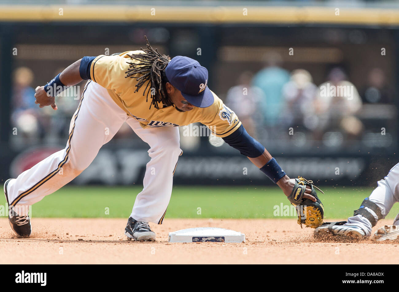 July 7, 2013 - Milwaukee, Wisconsin, United States of America - July 7, 2013: Milwaukee Brewers second baseman Rickie Weeks #23 applies the tag on New York Mets first baseman Josh Satin #13. Satin was called safe by the second base umpire during the Major League Baseball game between the Milwaukee Brewers and the New York Mets at Miller Park in Milwaukee, WI. Mets lead the Brewers 2-1 in the 8th inning. John Fisher/CSM. Stock Photo