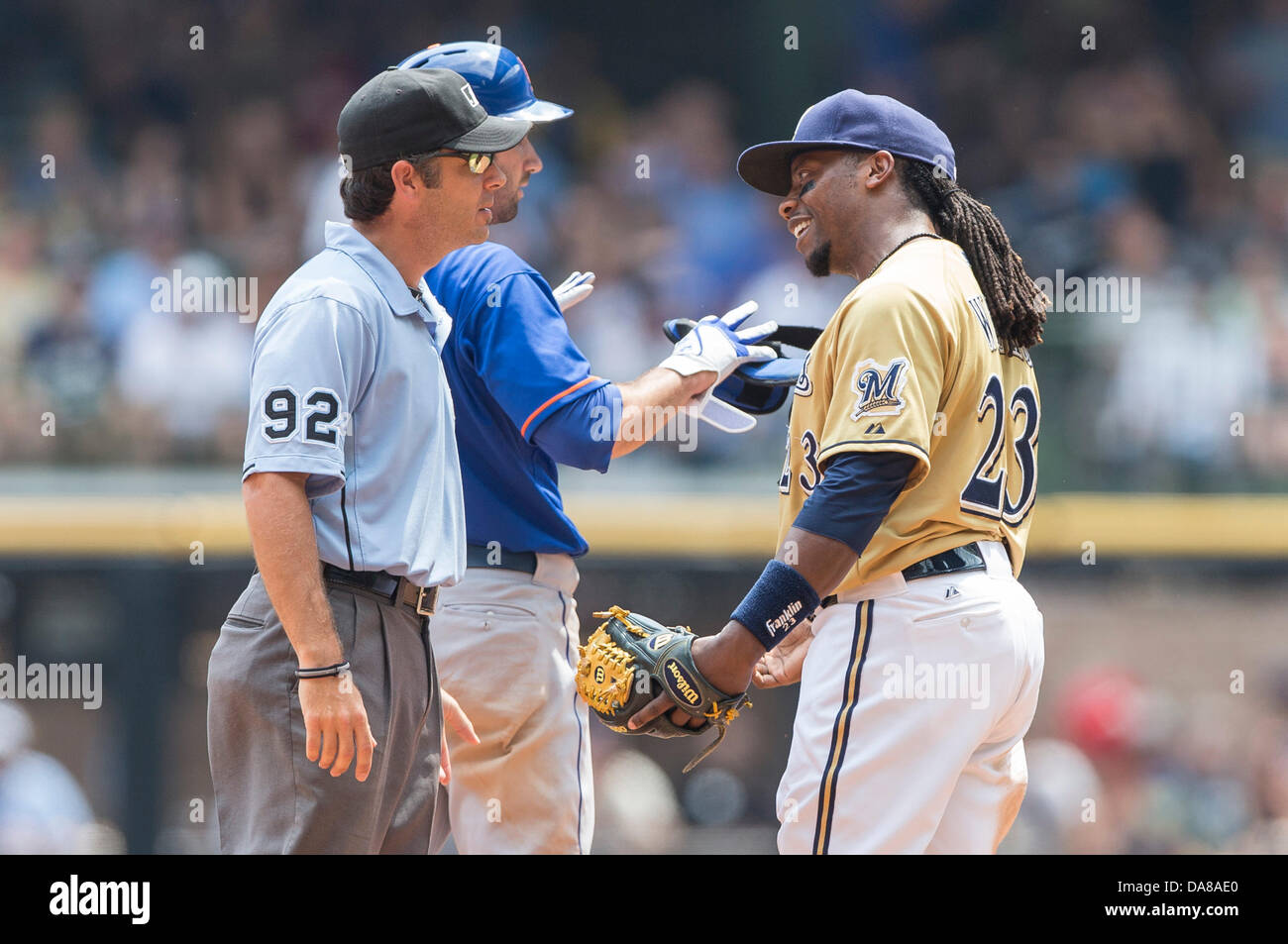 July 7, 2013 - Milwaukee, Wisconsin, United States of America - July 7, 2013: Milwaukee Brewers second baseman Rickie Weeks #23 discusses the call with umpire John Hirschbeck during the Major League Baseball game between the Milwaukee Brewers and the New York Mets at Miller Park in Milwaukee, WI. Mets lead the Brewers 2-1 in the 8th inning. John Fisher/CSM. Stock Photo