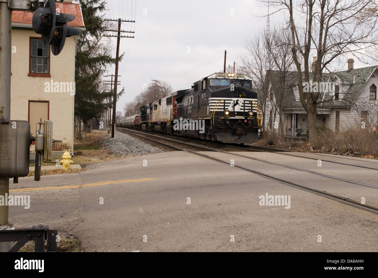 Norfolk Southern Railroad Freight Train Passes Over A Grade Crossing Stock Photo Alamy