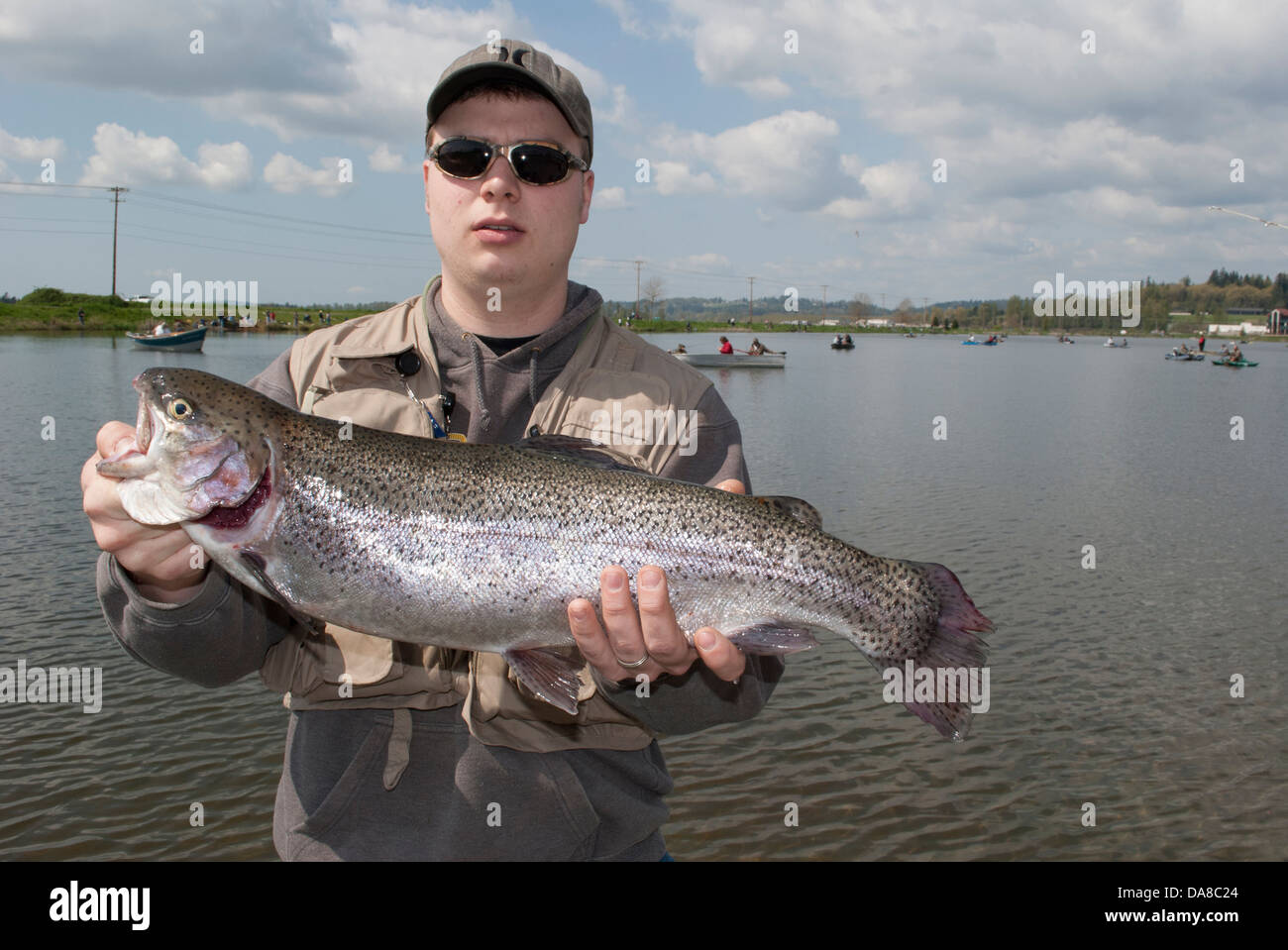 Fisherman with a winning Rainbow trout caught during an Adult Derby