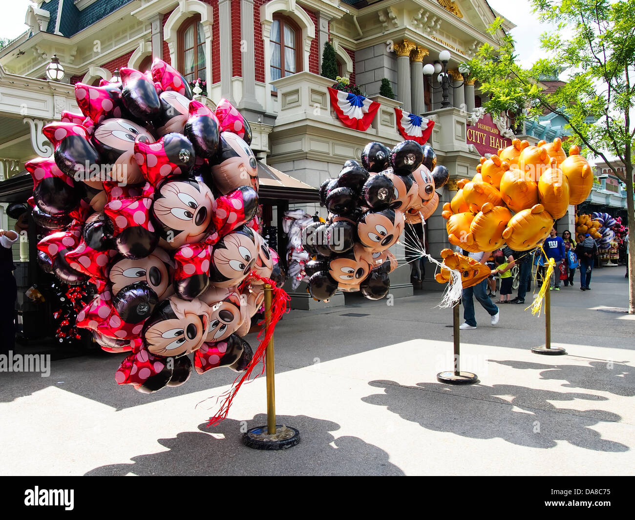 Mickey Mouse, Minnie mouse and Winnie the Pooh helium balloons on sale on  Main street at Disneyland Paris Stock Photo - Alamy